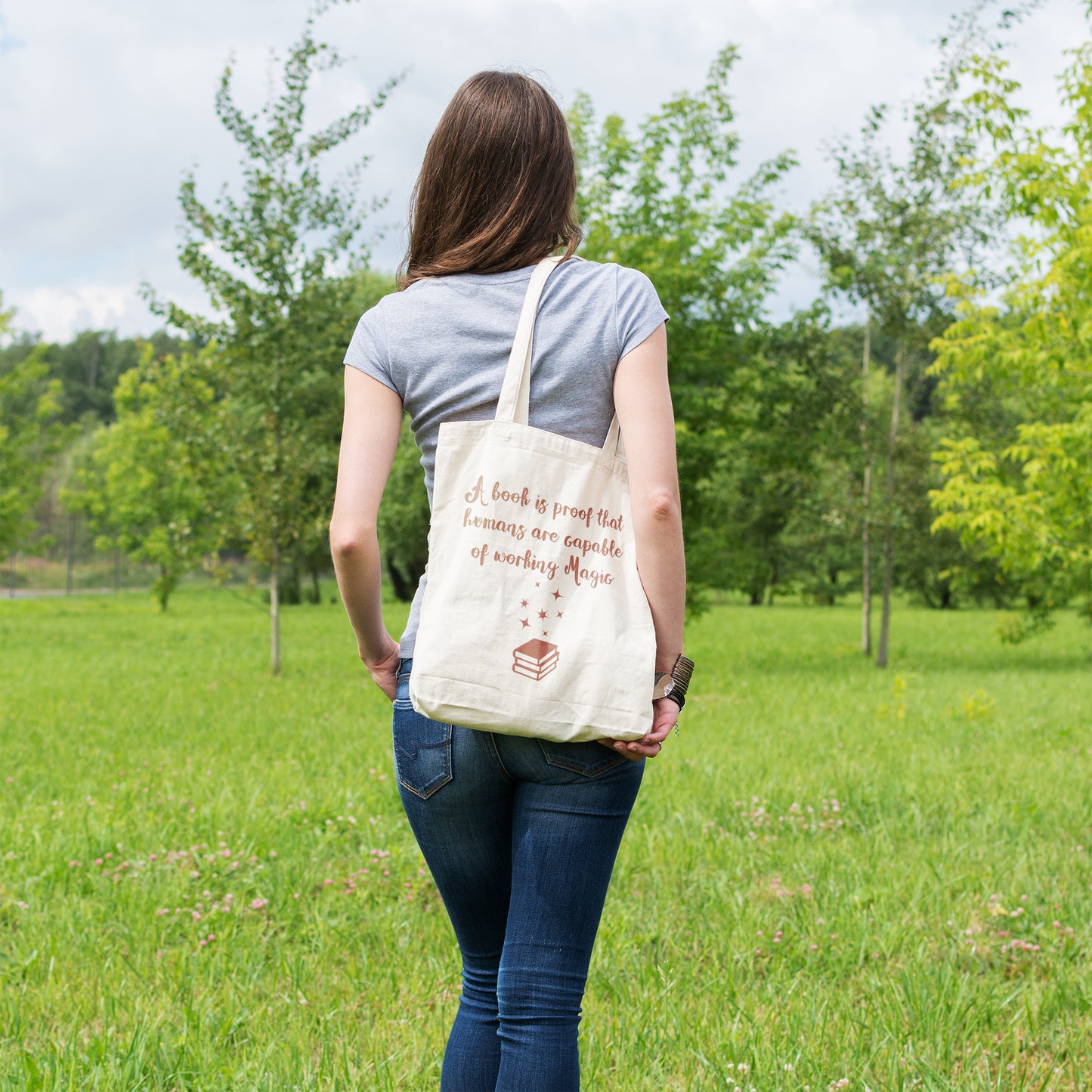 A book is proof that humans are capable of working magic | 100% Organic Cotton tote bag
