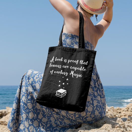 A book is proof that humans are capable of working magic | 100% Cotton tote bag - Adnil Creations